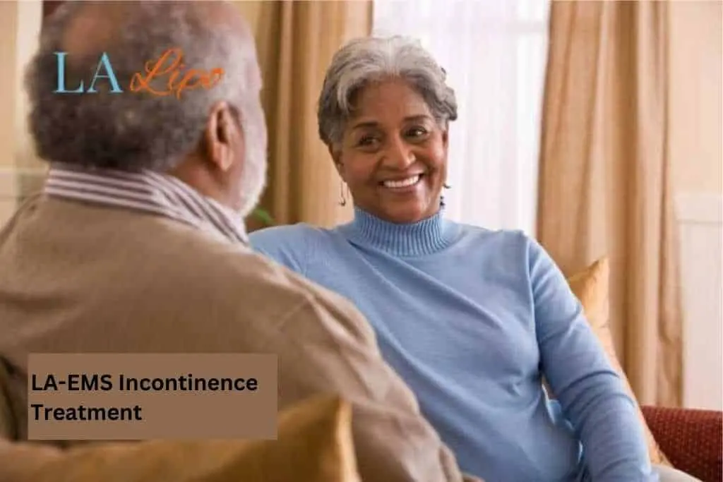 Couple sat smiling at each other - LA-EMS treatment Stockport