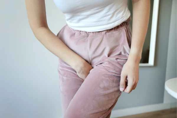 woman running for the toilet because of urinary incontinence Stockport